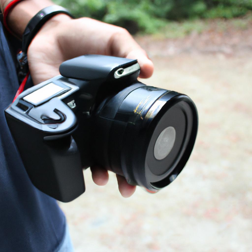 Person holding a branded camera
